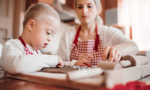 Kid and mom making cookies