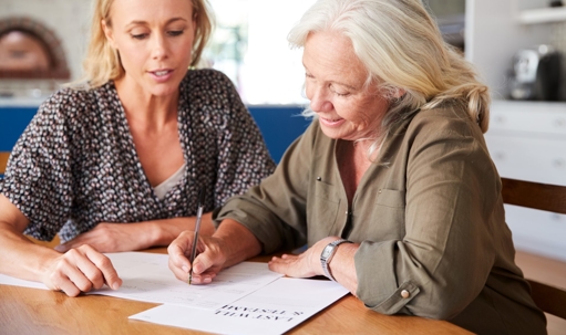 mom and daughter working on paperwork